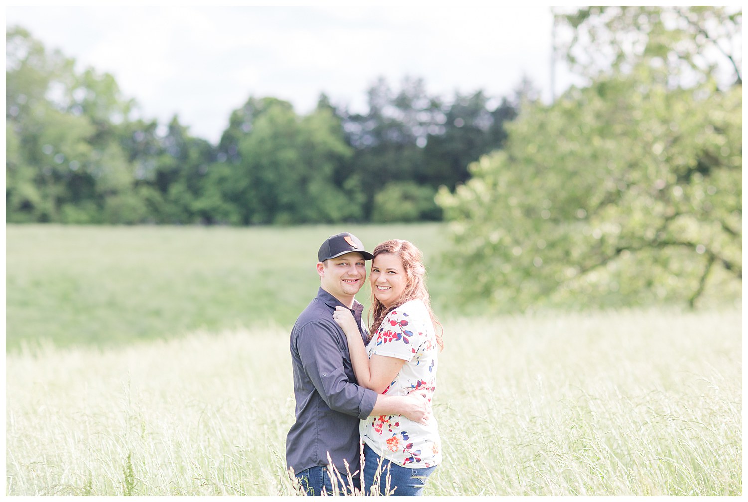 Charlotte Wedding Photographer shoots engagement session in tall prairie grass at Daveste Vineyards in Troutman NC