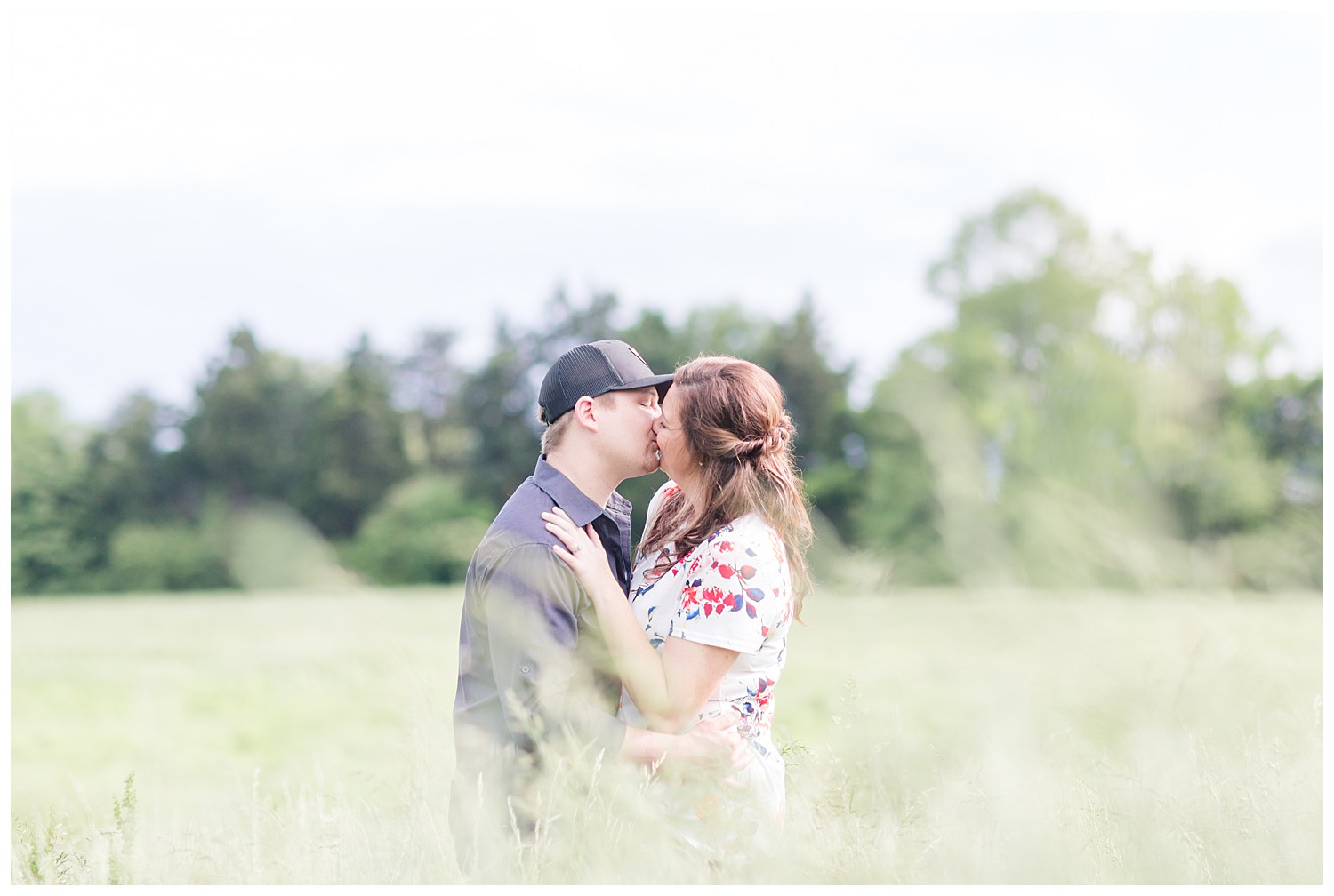 Charlotte Wedding Photographer shoots engagement session in tall prairie grass at Daveste Vineyards in Troutman NC