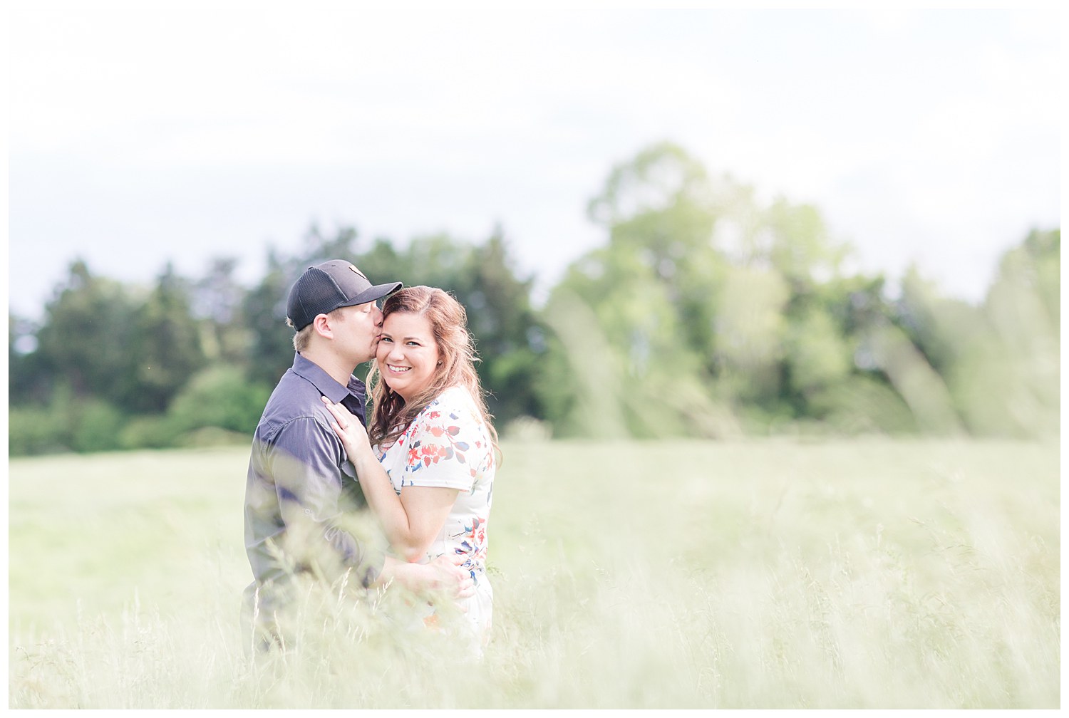 Charlotte Wedding Photographer shoots engagement session in tall prairie grass at Daveste Vineyards in Troutman NC