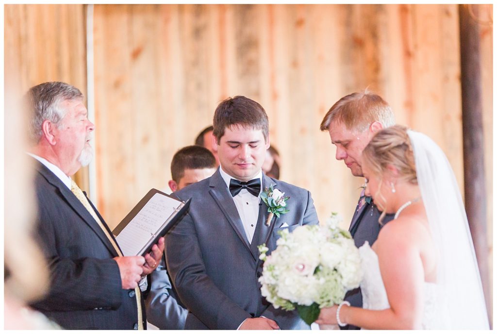 groom sheds a tear as he sees his bride for the first time