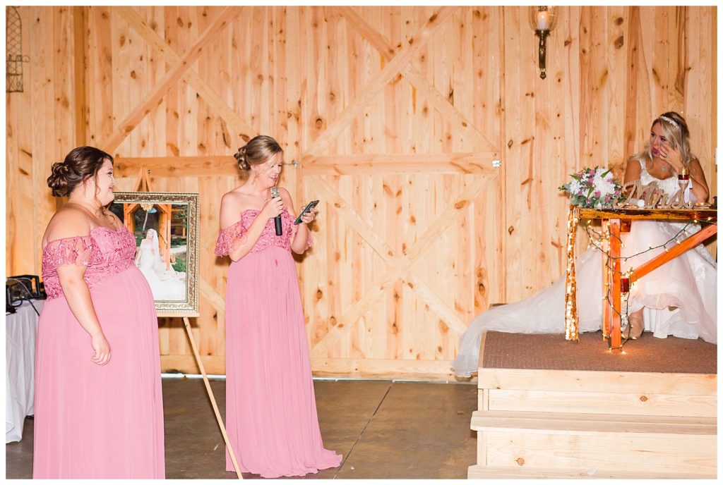 Bridesmaids toast at wedding at the Shed at Quiet Hollow in Maiden, NC by Charlotte wedding photographer, Jacqueline Jones