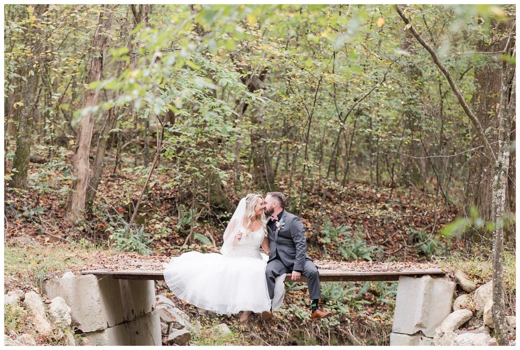 Bride and groom on bridge at the Shed at Quiet Hollow in Maiden, NC by Charlotte wedding photographer, Jacqueline Jones