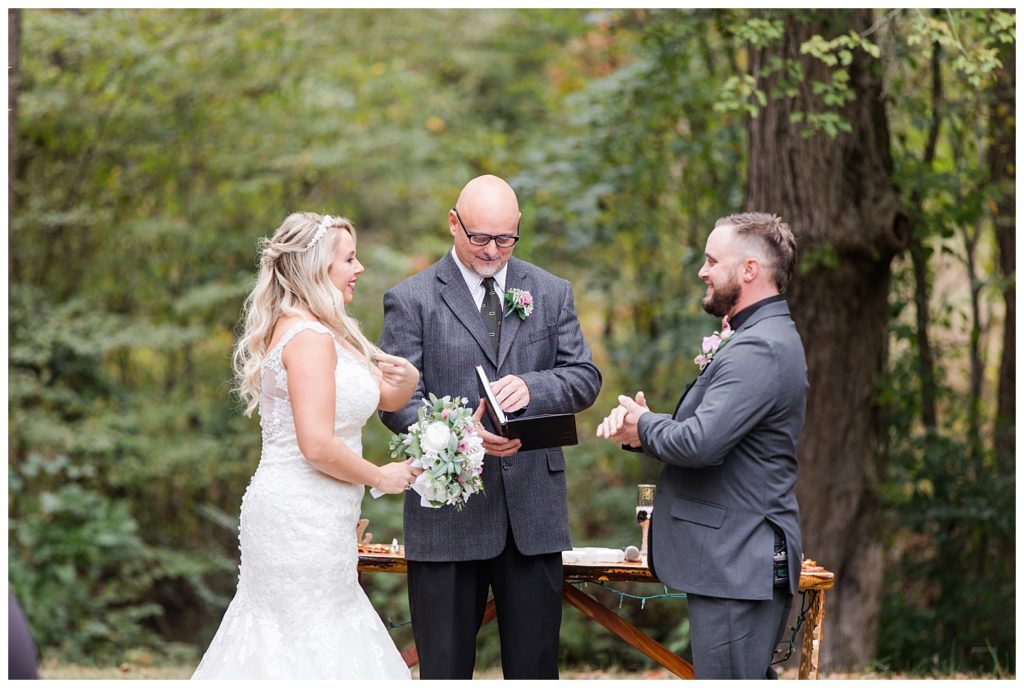 Bride and groom at the alter at the Shed at Quiet Hollow in Maiden, NC by Charlotte wedding photographer, Jacqueline Jones