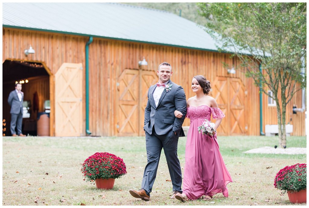 Bridesmaid and groomsman at the Shed at Quiet Hollow in Maiden, NC by Charlotte wedding photographer, Jacqueline Jones