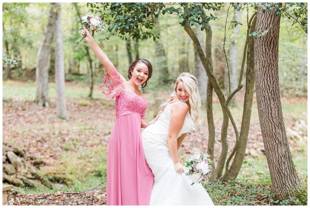 Bride and bridesmaid at the Shed at Quiet Hollow in Maiden, NC by Charlotte wedding photographer, Jacqueline Jones