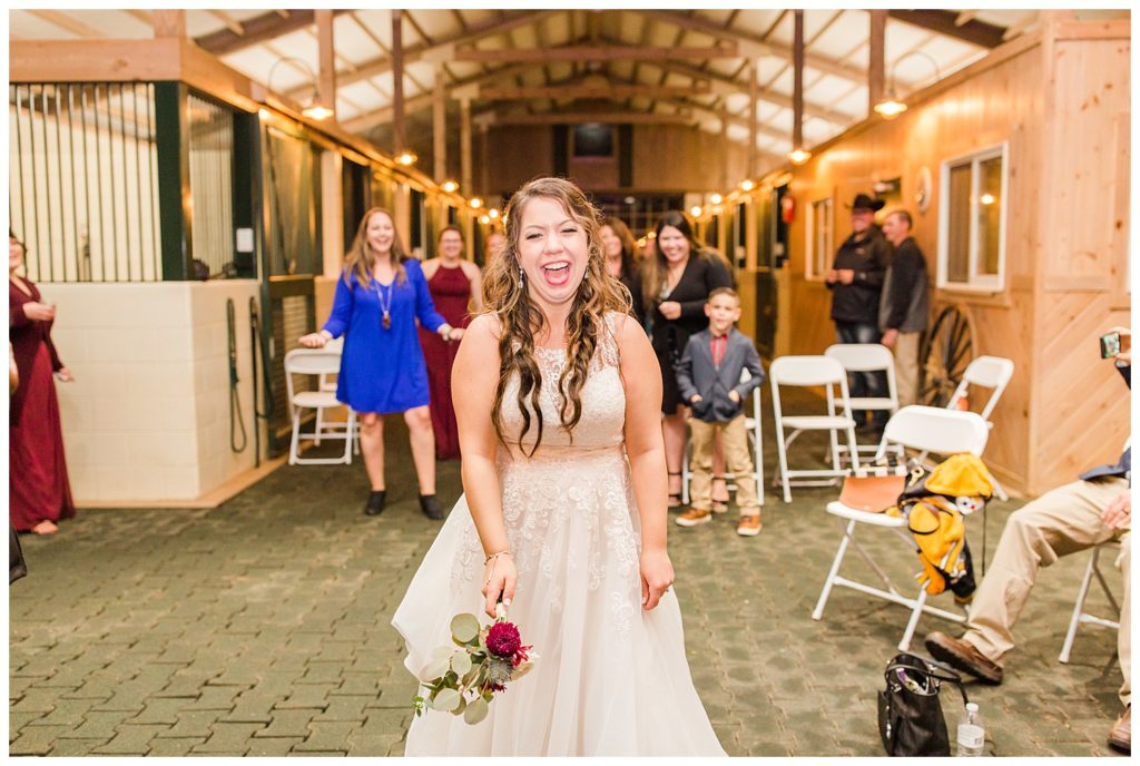 Bride on dancing floor in Morganton, NC at Double C’s Acres by Charlotte wedding photographer, Jacqueline Jones