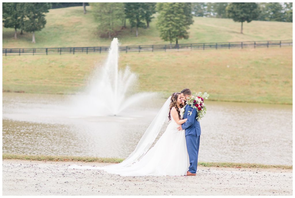 Couple at lake in Morganton, NC at Double C’s Acres by Charlotte wedding photographer, Jacqueline Jones