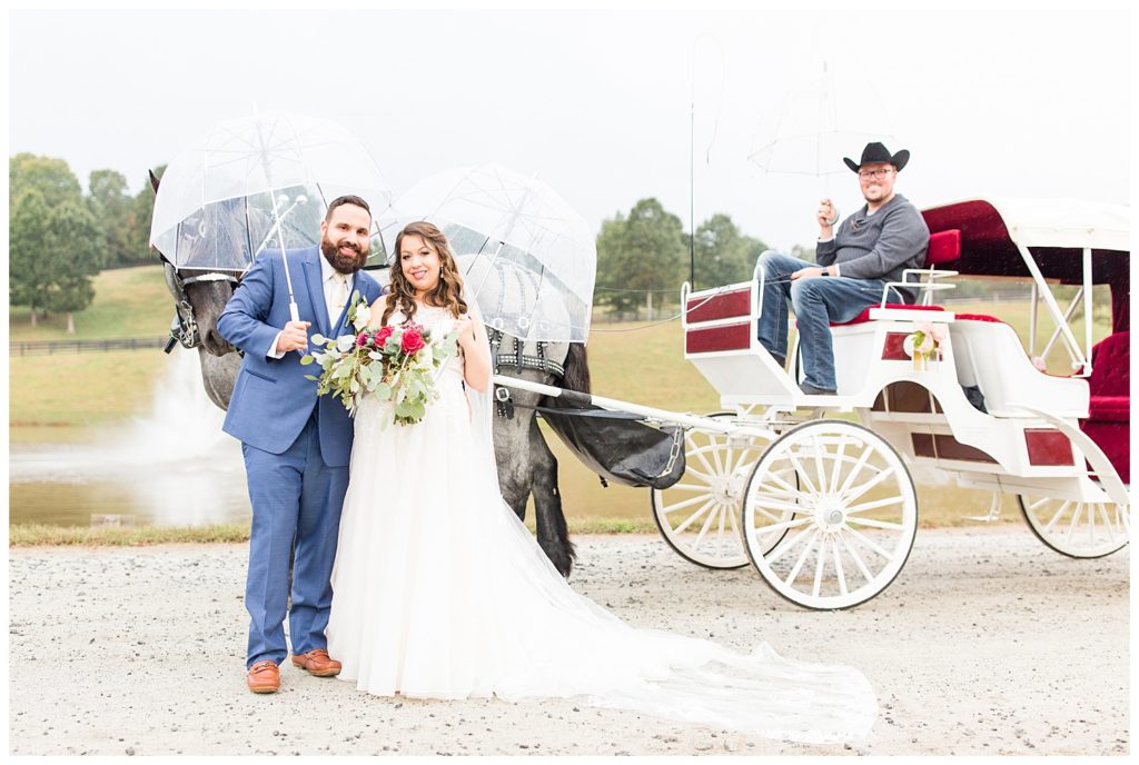 Couple at horse drawn carriage in Morganton, NC at Double C’s Acres by Charlotte wedding photographer, Jacqueline Jones