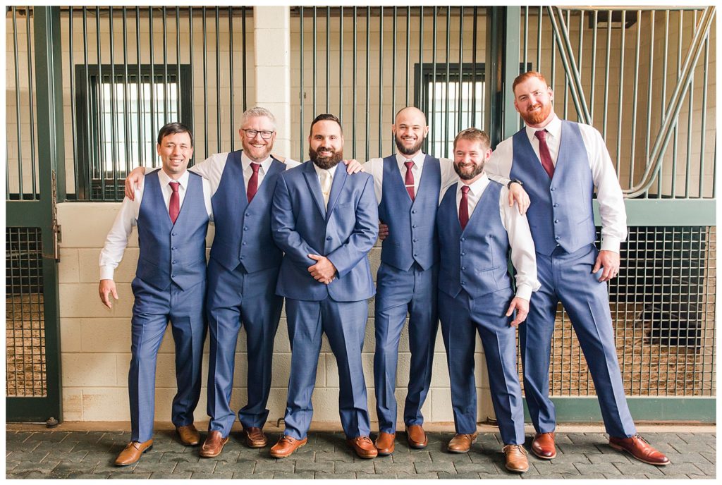 Groom and groomsman in Morganton, NC at Double C’s Acres by Charlotte wedding photographer, Jacqueline Jones