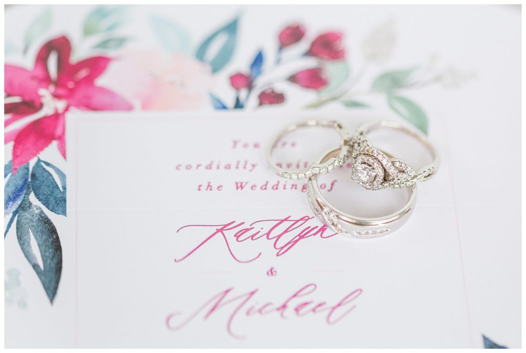 Wedding invitation and rings in Morganton, NC at Double C’s Acres by Charlotte wedding photographer, Jacqueline Jones