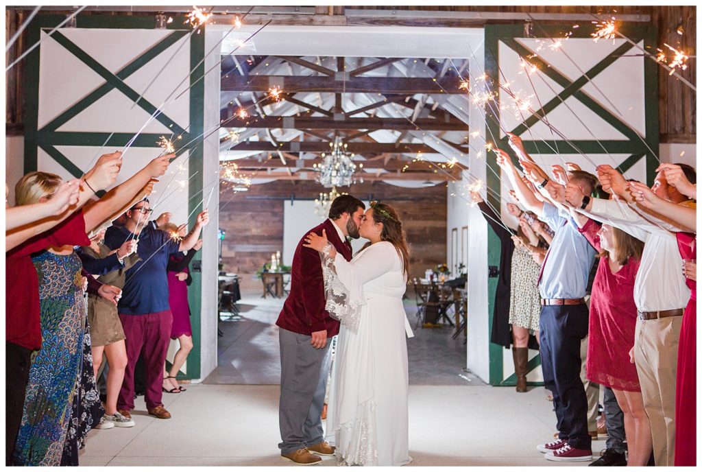 Bride and groom kissing at wedding at Circle M Farm in Lincolnton, NC by Charlotte wedding photographer, Jaqueline Jones