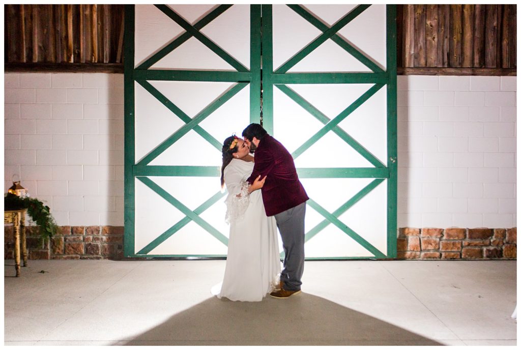 Bride and groom kissing at Circle M Farm in Lincolnton, NC by Charlotte wedding photographer, Jaqueline Jones