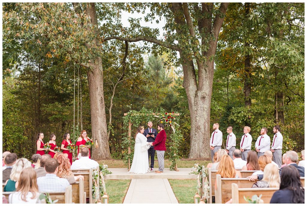 Bride and groom at alter at Circle M Farm in Lincolnton, NC by Charlotte wedding photographer, Jaqueline Jones