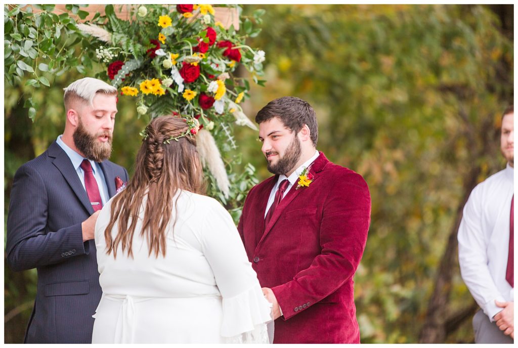 Bride and groom at alter at Circle M Farm in Lincolnton, NC by Charlotte wedding photographer, Jaqueline Jones