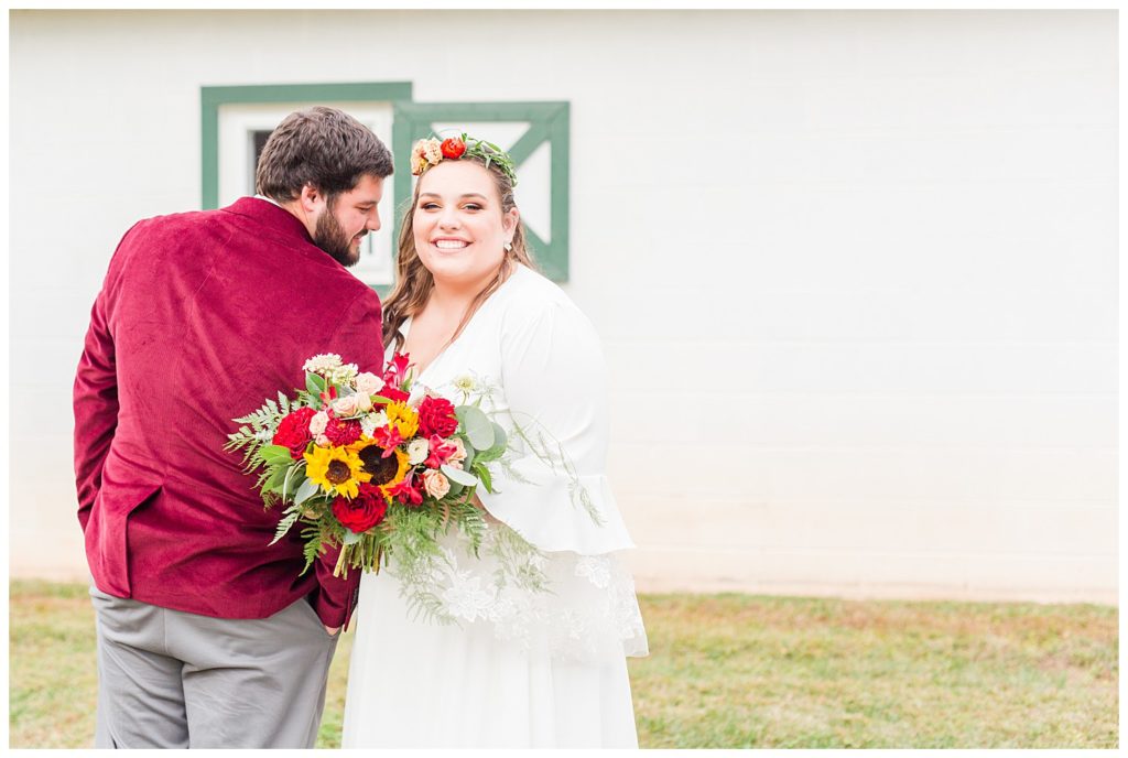 Groom and bride at wedding at Circle M Farm in Lincolnton, NC by Charlotte wedding photographer, Jaqueline Jones