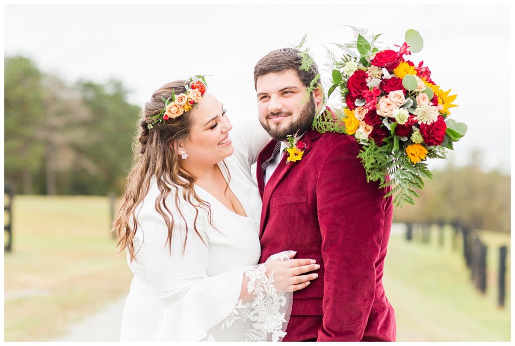 Groom and bride at wedding at Circle M Farm in Lincolnton, NC by Charlotte wedding photographer, Jaqueline Jones