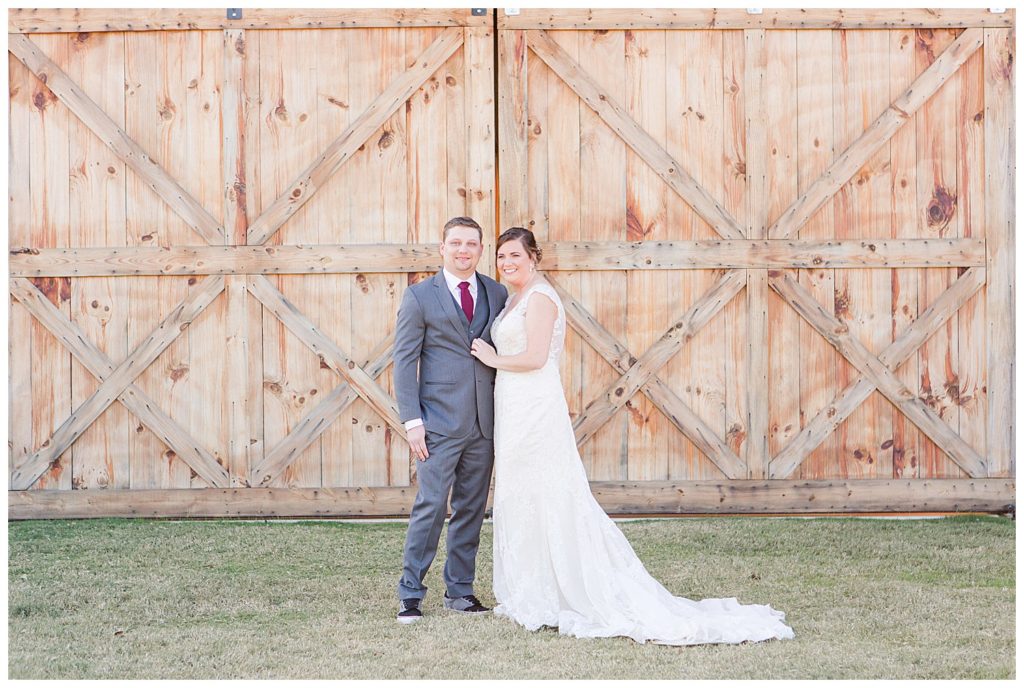 Bride and groom at the Barn at Sandcastle in Charlotte, NC by Charlotte wedding photographer, Jacqueline Jones