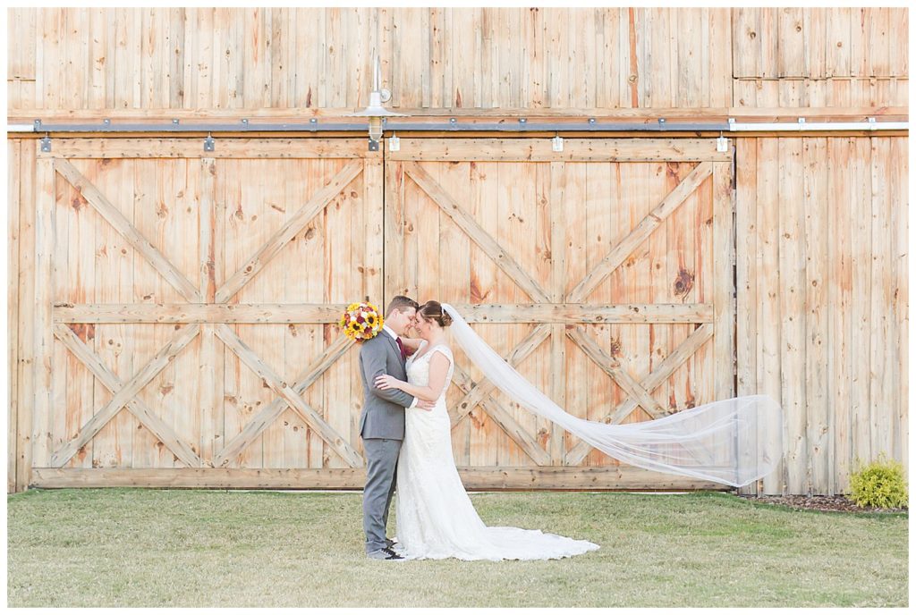 Bride and groom at the Barn at Sandcastle in Charlotte, NC by Charlotte wedding photographer, Jacqueline Jones