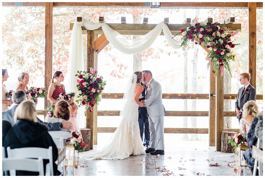 Bride and groom kissing in Mount Pleasant at the Farm at Brusharbor by Charlotte wedding photographer, Jacqueline Jones