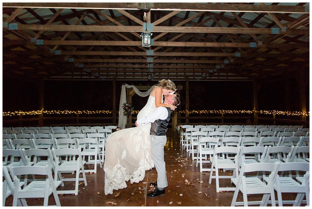 Bride and groom kissing at NC wedding in Mount Pleasant at the Farm at Brusharbor by Charlotte wedding photographer, Jacqueline Jones