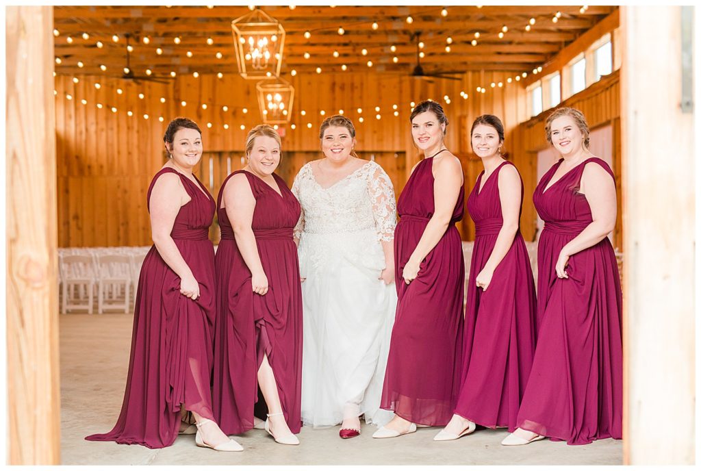 Bride and bridesmaids inside the Barn at Sandcastle Farm in Dallas, NC by Charlotte wedding photographer, Jacqueline Jones